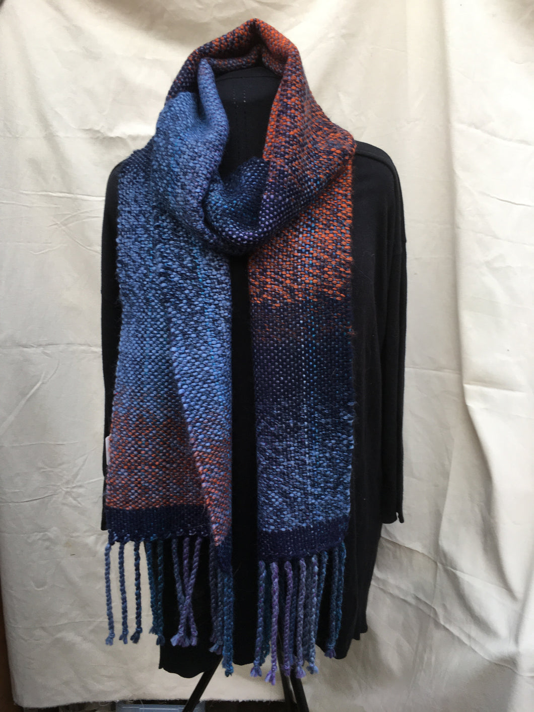 Super long chunky acrylic scarf in graduated colours.
